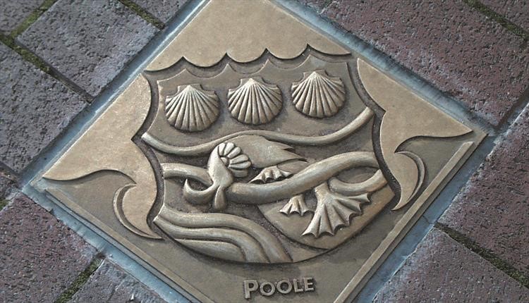 Poole crest in brick road